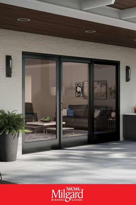 There’s so much to consider when shopping for a patio door. What kind of material is right for your home: vinyl, fiberglass or aluminum? Do you want sliding or swinging? What about Moving Glass Walls that focus on indoor-outdoor living? If you’re ready to find the right patio door for your home, our complete guide can help you get started. #MilgardDoors #PatioDoors #SlidingPatioDoors #SlidingGlassDoors Patio French Doors, Replacement Patio Doors, Sliding Door Window Treatments, Sliding Doors Exterior, Sliding Glass Doors Patio, Door Window Treatments, Glass Doors Patio, Sliding Door Design, Dark Elegance