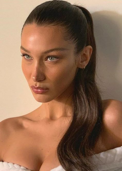 Bella Hadid Ponytail Tutorial: How To Get Bella Hadid's Sleek Pony | BEAUTY/crew Bella Hadid Hair, Bella Hadid Makeup, Slick Ponytail, Slicked Back Ponytail, Ponytail Tutorial, Wavy Ponytail, Bella Hadid Outfits, Hair Frizz, Hair Pomade