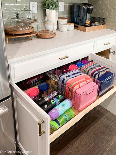 How To Organize Kitchen Island Cabinets, New Build Organization Ideas, Home Kitchen Organization Ideas, Organization In The Kitchen, Dress Pant Storage, Kitchen Vitamin Storage Ideas, Future House Organization, Apron Storage Ideas, Prescription Bottle Organization