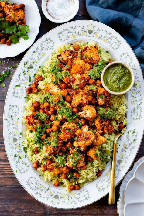 This Roasted Cauliflower with Chimichurri Rice is a flavor packed meal! Cauliflower & chickpeas seasoned and roasted until crispy over herby rice | ThisSavoryVegan.com #chimichurrirecipe #roastedcauliflower #veggiedinner Roasted Cauliflower Dinner Ideas, Chimichurri Cauliflower, Herby Rice, Cauliflower Meals, Chimichurri Rice, Chickpeas Roasted, Vegan Chickpea Recipes, Vegan Chickpea, Vegan Cauliflower