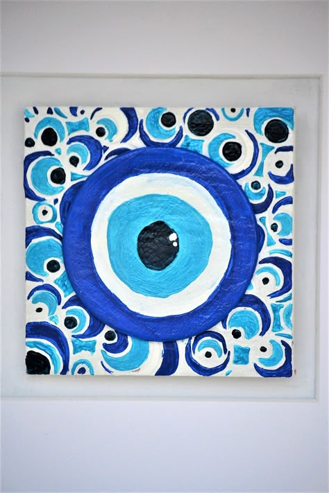 Clay painted evil eye on bas-relief wooden tile for bad spirits and evil gossips keeping away! Find more unconvetional decorate ideas on greekshadesofblue on instagram... #evileye#ceramicevileye#claygoodluckcharm#blueevileye#bluedecor#claydecor#ceramictile#mixedmediaart#turquoisedecor#bluewhitedecor#greekart Tile Painting Ideas Art, Evil Eye Painting Ideas, Evil Eye Painting Canvases, Evil Eye Art Painting, Evil Eye Canvas Painting, Painting Evil Eye, Evil Eye Painting, Beginner Painting On Canvas, Decorate Ideas