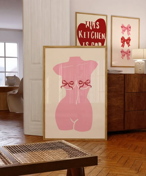 Pinky wall art featuring a torso with a red ribbon. Perfect for a girly bedroom or.
#apartmentdecor #homedecor #smallspaces #interiordesign #decorinspiration Nail Studio Wall Art, 3 Posters On Wall, Pink Girly Room Aesthetic, Room Prints Aesthetic, Dorm Inspo Pink, Pink Decor Bedroom, Pink Aesthetic Posters, Pink Poster Wall, Funky Art Prints