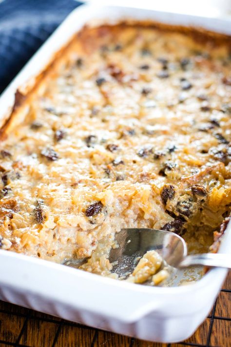 close up of rice pudding in baking dish Rice Pudding In Oven Recipe, Vegan Baked Rice Pudding, Rice Pudding With Oatmilk, Rice Pudding Baked In Oven, Baked Rice Pudding Recipes Oven, Baked Rice Pudding With Cooked Rice, Baked Rice Pudding Oven, Instant Rice Pudding Recipe, Rice Pudding Recipe Baked