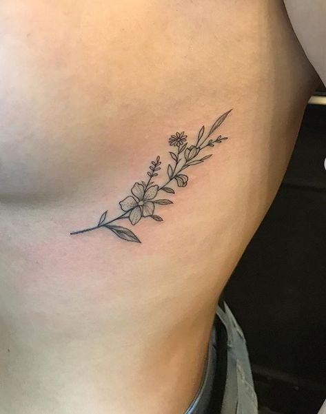 Hip Tattoos Women Outline, Marigold Rib Tattoo, Wild Flower Rib Tattoo, Flower Tattoos Rib Cage, Tulip Rib Tattoo, Wildflower Rib Tattoo, Wildflower Tattoo Ribs, Rib Floral Tattoo, Flower Ribcage Tattoo