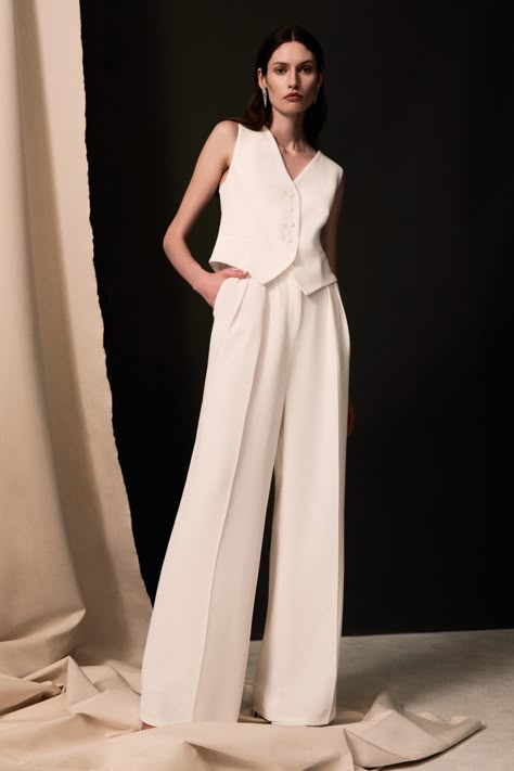 Woman wearing an ivory silk waistcoat and trouser suit Modern Wedding Outfit Brides, Rehearsal Dinner Suit, Androgynous Wedding Attire, Female Wedding Suit, Wedding Trouser Suits, Women Wedding Suit, Lesbian Wedding Outfits, Egypt Wedding, Bridal Pant Suit