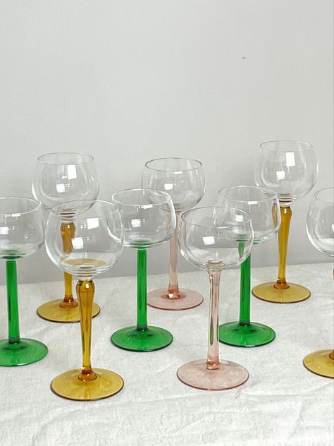 Collection of different wine glasses varying in coloured stems. Vintage wine glasses Vintage Glassware Display, Mid Century Lamps, Glassware Display, Wine Glasses Vintage, Vintage Cocktail Glasses, Mid Century Glassware, Saving The Planet, Colored Glassware, Funky Decor