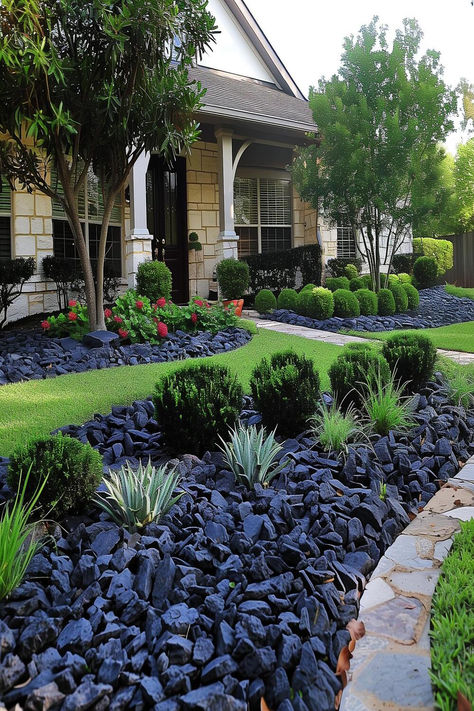 Sophisticated front yard with neatly arranged black rocks and lush landscaping around a cozy home. Front Yard Landscaping Black Rocks, Landscape With Black Rocks, Black Rock Landscaping Front Yard, Front Yard Landscaping With Black Mulch, Landscaping Black Mulch, Black Landscaping Rock, Black Rock Landscaping Ideas, Black Landscape Rock, Black Lava Rocks Landscaping