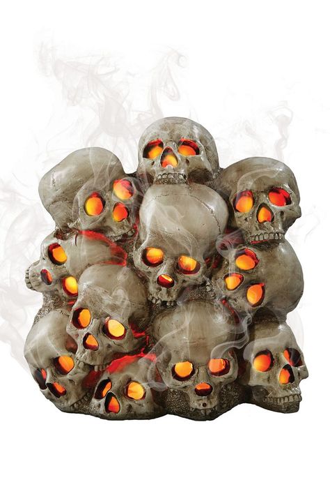 This Halloween, add a bit more frightful atmosphere to the spooky graveyard in front of your haunted home with this cool new Fogging Skull Pile. Spooky Graveyard, Graveyard, Holiday Decor, Halloween