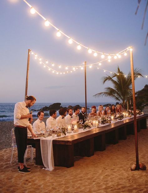 Beach Wedding Head Table, Beach Wedding Lighting, Beach Wedding Dinner Table, Beach Wedding Lights, Lake Beach Wedding, Beach Wedding Dinner, White Beach Party, Wedding Dinner Ideas, Dinner By The Beach