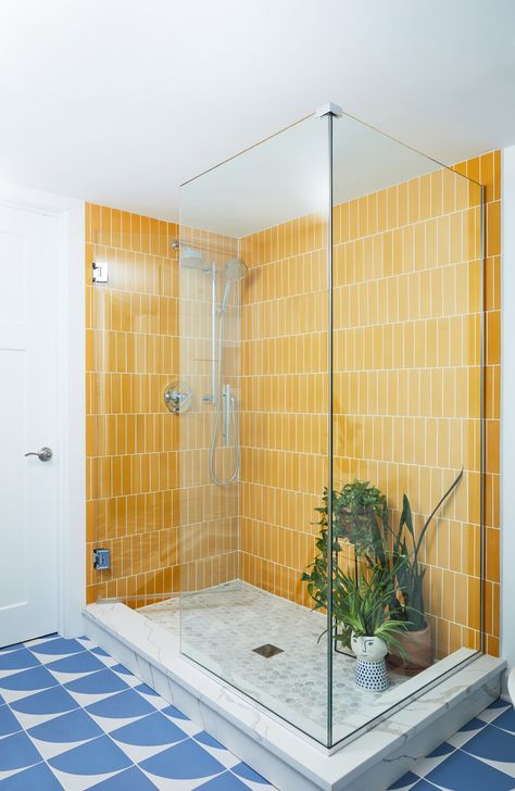 Stacked Yellow tile, printed blue tile, natural wood vanity, white quartz countertops, midcentury modern, vintage modern, colorful home, bold colored bathroom, yellow bathroom Yellow Shower Room, Primary Color Bathroom, Yellow Tiles Bathroom, Blue And Yellow Bathroom Ideas, Yellow Blue Bathroom, Blue Yellow Bathroom, Colorful Bathroom Ideas Bright, Bright Color Bathroom, Yellow And Blue Bathroom