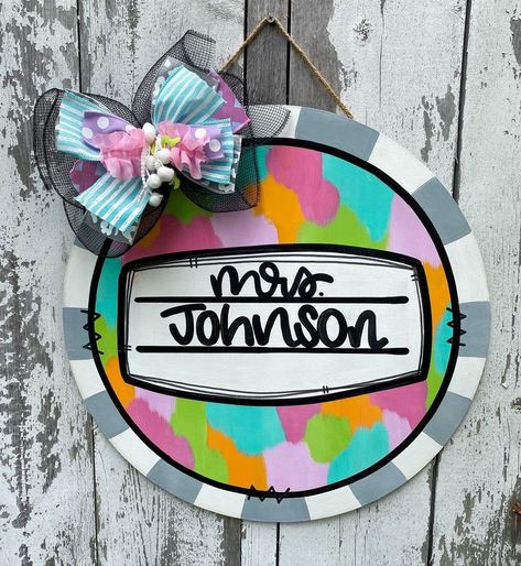 "Brighten up your door with our high-quality Teacher Door Decor. Affectionately handcrafted with a personal touch, our charming Personalized Door Hanger is a surefire way to welcome your students back to school. Expertly designed like a beautiful Teacher Wreath, this piece adds a dash of color and optimism to any Classroom Decor. It's not just a School Sign, it's a token of appreciation selected with thought. Make a teacher's day memorable by gifting them this alluring piece of art. This Cl Teacher Door Wreaths, Classroom Door Hangers, Teacher Door Decor, Classroom Wreath, Teacher Door Hanger, Glass Storm Doors, Teacher Wreaths, Teacher Door Signs, Teacher Door Hangers