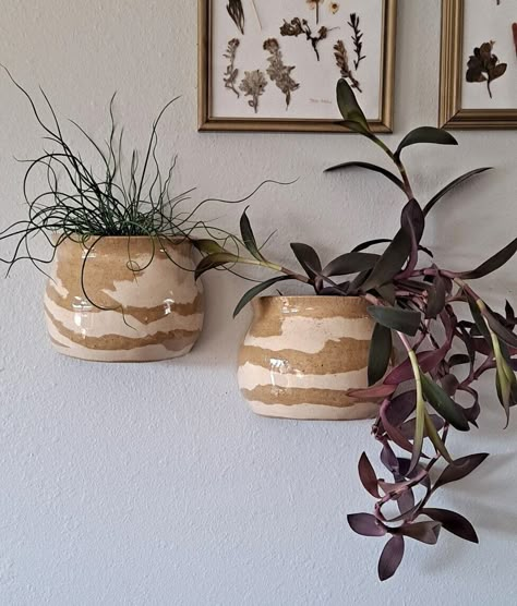 This duo of planters is the perfect artistic way to display your houseplant. Hang them on a wall or in front of a window. All hanging planters include a drainage hole at the bottom. Watering tips are included with purchase. Planters are hand-made on a pottery wheel.  Note: purchases do not include the plant. Purchases only include the ceramic hanging planter and mounting string/wire if relevant. This purchase includes BOTH hanging planters, as they come as a pair. *Handmade pottery is an artform Wall Hanging Vase, Plant Pot Ceramic Ideas, Wall Hanging Pottery, Ceramic Hanging Planter, Pottery Wall Hangings, Pottery Wheel Ideas, Colorado Apartment, Plant Pottery, Bottom Watering