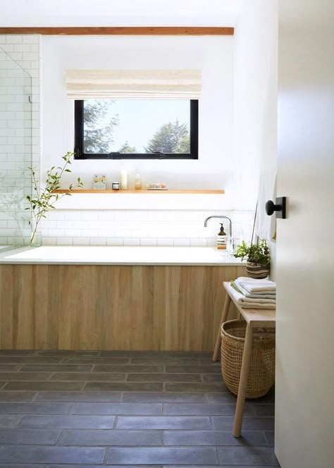 California spa bathroom with wood-grain ceramic tile tub surround. #remodelista #bathroom #interiordesign #tile #interiorinspiration #remodel #bathroomtiles Wood Tub Surround, Remodelista Bathroom, Tile Tub, Tile Tub Surround, Bathtub Surround, Spa Bathroom, Glass Shower Enclosures, Spa Like Bathroom, Tub Surround