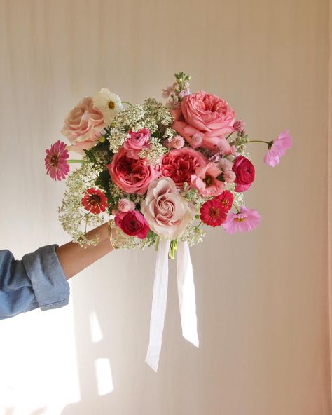 summer bridal bouquet made with zinnias, mini babies breath, roses, ranunculus, cosmos, gomphrena, lisianthus Summer Bridal Bouquet, Bridal Bouquet Summer, Babies Breath, Ranunculus, Wedding Bouquet, Bridal Bouquet, Cosmos, Bouquets, Flower Arrangements