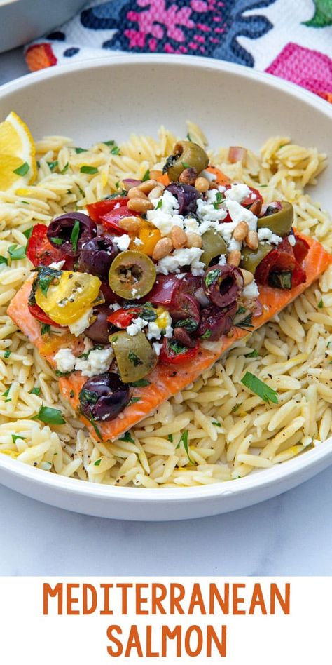 Mediterranean Salmon -- This Mediterranean Salmon is a flavorful, easy weeknight dinner that brings together the best of Greek ingredients. Oven-baked salmon is topped with olives, tomatoes, red onion, fresh herbs, feta, and more and is served over lemon orzo for a bright and simple meal. via @wearenotmartha Mediterranean Canned Salmon Recipes, Salmon And Orzo Dinners, Mediterranean Salmon Dinner, Greek Salmon, Grilled Vegetable Salads, Canned Salmon Recipes, Mediterranean Salmon, Salmon Chowder, Delicious Salmon Recipes