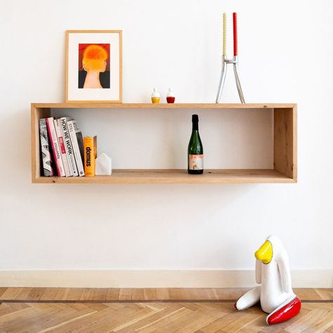 In the living room of the renovation project Koninginnegracht, low installed wall shelf and low furniture were thought to increase the feeling of height of the entire room, resulting in a very spacious and minimal living. Bright colours and objects infuse the whole living room with a fresh and contemporary feel. Design by @camilla_casiccia_office Elm wood by @beckerwoodsupply Photography by @sophieblommersphotography #interiordesign #interiorstyling #styling #interiorarchitecture #spatial... Shelf Styling Living Room, Colorful Shelf, Minimal Living, Shelf Styling, Bright Color, Renovation Project, Wall Shelves, Interior Styling, Interior Architecture