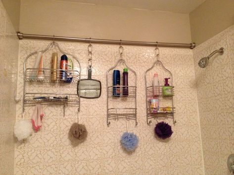 Install a tension rod in your shower and hang multiple shower caddies for additional storage. Makeover Kamar Mandi, Rv Bathroom, Bathroom Hacks, Bathroom Storage Solutions, Shower Organization, Small Bathroom Storage, Downstairs Bathroom, Shower Rod, Creative Storage