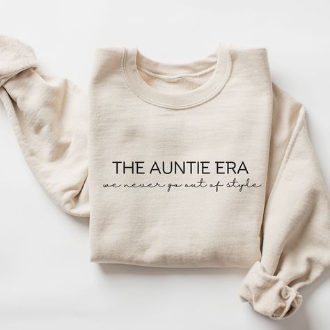 In My Auntie Era Sweatshirt, Gift for Aunt, Minimalist Aunt Shirt, New Auntie Sweatshirt, Baby Announcement for Aunt, Funny Aunt Shirt  ♥ WHY YOU WILL LOVE YOUR SWEATSHIRT ♥ * Unique cute gift for everyone that is incredibly easy and stress-free to order & receive * Design is a the words Golden mama writing with trendy retro color and font. * Softest quality 50% cotton, 50% polyester with loose fit that runs true to size (unisex) * Extreme comfort with no bulky side seams for great shape and fit that lasts * Collar is ribbed knit, so it retains its shape even after washing * Our unique designs are professionally permanently printed with Direct to Garment printing which feels smooth and flexible :: Printed with Eco-Friendly Inks :: Printed and Shipped from the USA :: Double-Needle Stitching Sister To Aunt Announcement, In My Auntie Era, Aunt Baby Announcement, Auntie Sweatshirt, Auntie Era, Aunt Shirt, Gift For Aunt, Aunt Shirts, Aunt Gifts