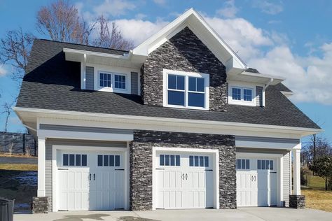 The main level of this shingle style garage apartment gives you parking for 3 cars behind 9'x8' doors. A man door on the right gives you access to your property. The upper floor is a fully-functioning apartment complete with family room open to the kitchen, a bedroom suite with laundry and a large window seat looking out over the right. An angled fireplace and seating at the kitchen are two nice touches in this tidy plan. The foundation is a slab on frost footings. Three Stall Garage With Apartment, 2 Story 3 Car Garage, Three Stall Garage, Four Car Garage Plans, 3 Stall Garage With Apartment Above, Barndo Garage With Apartment, 3 Car Garage With Apartment Above, 4 Car Garage With Apartment, 3 Car Garage Apartment Plans