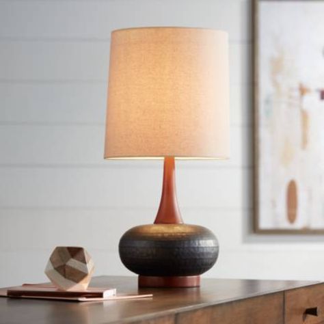 Add Mid-Century Modern charm to your decor with this attractive wood and ceramic table lamp. Overall: 24 1/2" high. Base is 5 1/4" wide. Shade is 11" across the top x 12" across the bottom x 12" high. Weighs 5.7 lbs. Uses one maximum 100 watt standard-medium base bulb (not included). On-off socket switch. Black cord and plug. Style # 9H566 at Lamps Plus. Mid Century Modern Lamp, Mid Century Modern Table Lamps, Contemporary Retro, Home Office Colors, Mid Century Table Lamp, Mid Century Modern Table, Traditional Contemporary, Mid Century Lamp, Bedside Night Stands