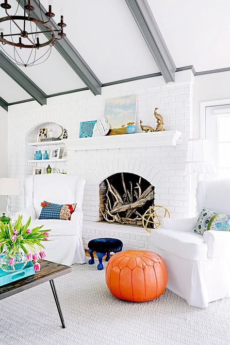 Living room with fireplace filled with decorative wood Ceiling Beams Living Room, Painted Beams, Beams Living Room, White Brick Fireplace, Grey Ceiling, Wood Beam Ceiling, Living Room Ceiling, White Brick, Wood Ceilings