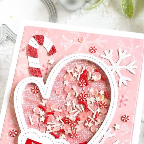 Adelle Emery on Instagram: "What's holiday card making with some shaker cards! The Mitten Shaker die set from @prettypinkposh is just the cutest! I paired it up with a few more products to make some pink sugary winter goodness.  Products . PPP Mitten Shaker die set . PPP Holiday Scripts stamp set . PPP Winter Mug die set . PPP Layered Snowflake stencil set . LF Knit Picky Winter paper pad  #prettypinkposh #cardmakingideas #cardmakersofinstagram #cardmaking #cardmaker #diycard #stamping #clearstamps #diycards #cardmakingfun #cardinspiration #handmadecard #cardmakers #makingcards" Christmas Shaker Cards, Christmas Shaker Cards Handmade, Pretty Pink Posh Christmas Cards, Pretty Pink Posh Snowman Shaker, Pretty Pink Posh Ghost Shaker, Snowman Shaker Card, Holiday Script, Snowflake Stencil, Card Making Tools