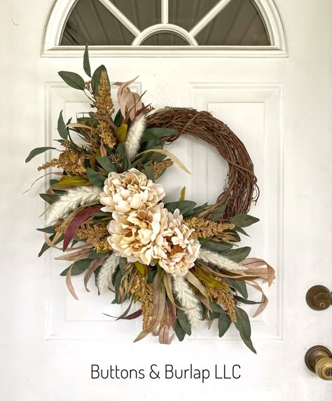 This fall wreath has cream peonies, seeded stems, and lots of flowing eucalyptus greenery. This wreath measures 22” wide and at 25” in length. Order processing time is 2 weeks. Fall Wreath With Feathers, Fall Wedding Wreaths For Door, Boho Wreaths For Front Door, Rustic Wreaths For Front Door, Wreaths For Windows Inside, Fall Wedding Wreath, Unique Fall Decor, Tiny Bouquet, Diy Fall Wreath Ideas