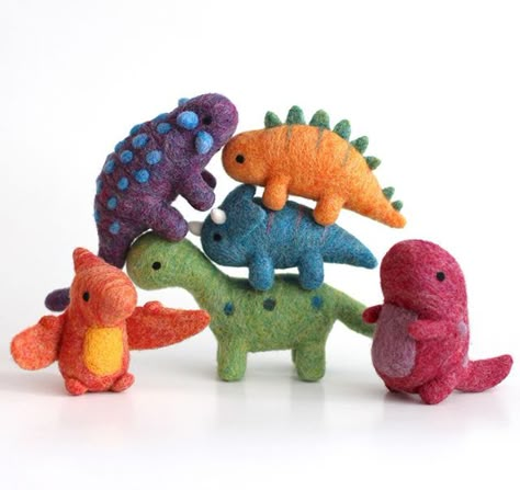 This colourful bunch of dinos will be going up in the shop at 7pm EST tonight along with some new shiny pins and keychains. I've been having too much fun trying to stack these little guys in different ways. . . . . . #dinosaurs #brontosaurus #trex #triceratops #stegosaurus #pterodactyl #ankylosaurus #dinosaursofinstagram #dinosaurart #dinosaursrule #dinolove #dinosaurlover #ilovedinosaurs #jurassicworld #jurassicjune #landbeforetime #prehistoric #sauropod #instaart #kawaiiart #cutestuff #arttoy Small Felted Animals, Felt Dinosaur, Felted Dinosaur, Felt Dinosaur Ornament, Dinosaur Needle Felt, Needle Felted Dinosaur, Triceratops Stuffed Animal, Needle Felted Cryptid, Diy Tricot