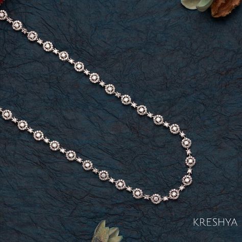 A Long Swarovski Garland made from the best quality Swarovski stones and custom silver alloy. Tarnish-free and scratch resistant. #swarovskichains #silverchains #silverjewllery #kreshya Silverswarovski Diamond Long Chain, Long Diamond Necklace, Innovative Jewellery, Necklace For Neckline, Temple Jewelry, Diamond Choker, Antique Gold Jewelry, Polki Jewellery, Swarovski Stones