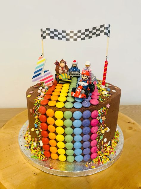 Super Mario Kart Smartie Rainbow Road Chocolate Cake with Rasberry Curd filling and Chocolate Buttercream. Children’s birthday cake. Celebration Cake. Lego Mario Birthday Cake, Super Mario Chocolate Cake, Steve And Maggie Birthday Cake, Go Kart Cake Ideas, Mario Wonder Cake, Super Mario Bday Cake, Mario Kart Birthday Party Ideas, Easy Sonic Cake, Birthday Cake Super Mario