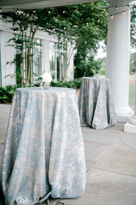 Blue Patterned Tablecloth Wedding, Blue Floral Linen Wedding, Blue And White Cocktail Table, Blue And Green Wedding Reception, Banquet Room Wedding Reception Ideas, Blue Green Silver Wedding, Sage Wedding Centerpieces Round Table, Grand Millennial Wedding Decor, Daniel Island Club Wedding