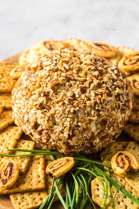 This Pineapple Pecan Cheese Ball recipe combines sweet pineapple, creamy cheese, and crunchy pecans for an unforgettable appetizer! #pineapplepecancheeseball #pineappleandpecancheeseball #pineapplepecancheeseballrecipe #creamcheesepineapplepecancheeseball #pecanpineapplecheeseball #recipeforpineapplepecancheeseball #creamcheesepineapplepecanball #numstheword Cheese All With Pineapple, Fruit Cheese Ball Recipes, Cheeseball Recipes With Pineapple, Hawaiian Cheese Ball, Pineapple Cheese Ball With Pecans, Pumpernickel Bread Appetizers, Pineapple Cheese Ball Recipe, Cheese Pennies Recipe, Cheese Ball Pineapple