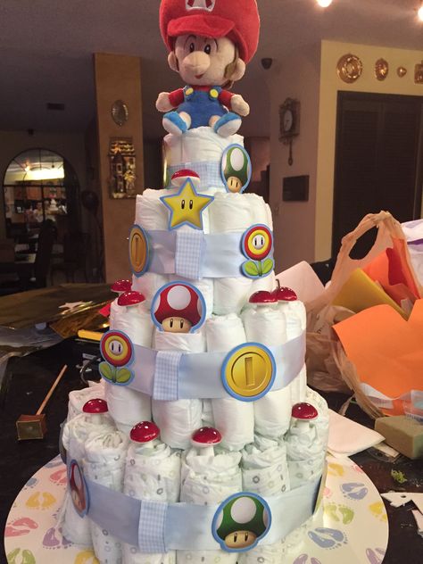 Baby shower diaper cake baby Mario Nintendo Gender Reveal, Super Mario Bros Gender Reveal, Mario Kart Gender Reveal, Mario Themed Gender Reveal, Video Game Baby Shower Theme, Gamer Baby Shower Ideas, Super Mario Gender Reveal, Mario Baby Shower Ideas, Gamer Gender Reveal Ideas