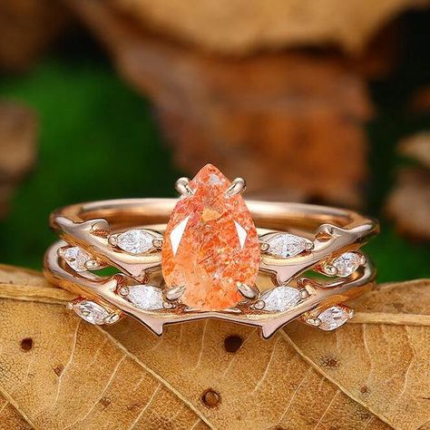 Engagement Ring Metal Type: 925 Sterling Silver, Soild 10k Gold, Solid 14k Gold, Solid 18k Gold Center Stone:  Nature Sunstone Center Carat Weight: Pear  Cut 1.50CT (6*9mm) Side Stones: Moissanites- 0.18ctw (DEF, VVS1)  Band Width: 1.4 5mm Wedding Ring Side Stones: Moissanites- 0.18ctw (DEF, VVS1)  Band Width: 1.45mm SKU: YFXR0555+YFXR0555-B- sunstone Accessories: *Shipped with beautiful ring box; *Directly price from Manufacturer, 1/3 the price from Jewelry Store; - Ethically Sourced Sunstone Wedding Ring, Orange Sapphire Engagement Ring, Engagement Rings Orange, Orange Wedding Ring, Orange Engagement Ring, Citrine Wedding Ring, Sunstone Engagement Ring, Citrine Engagement Ring, Citrine Ring Engagement