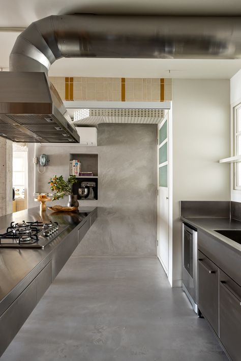 Photo 20 of 22 in Creamy Tile Polishes Up a Brazil Apartment’s Rough Concrete Edges - Dwell Brazil Apartment, Concrete Apartment, Metal Cabinet, Prefab Homes, Range Hood, Concrete Floors, Kitchen Room, Midcentury Modern, Modern Kitchen