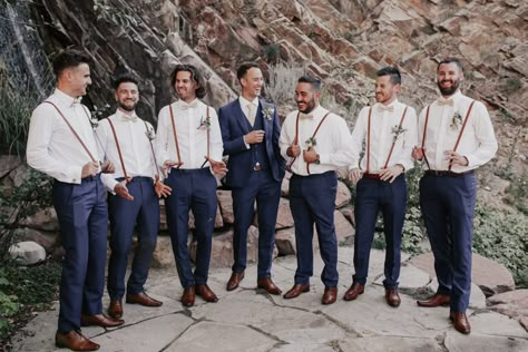 Groomsmen Navy blue suspenders champagne Suspenders Groomsmen Attire, Off White Groomsmen Attire, Groomsmen With Suspenders And Bowties, Navy Blue Groom And Groomsmen Suits, Champagne Wedding Party Groomsmen, Groomsmen Outfits Blue, Navy Wedding Party Attire, Navy Blue Groomsmen Attire, Rustic Groomsmen Attire Navy