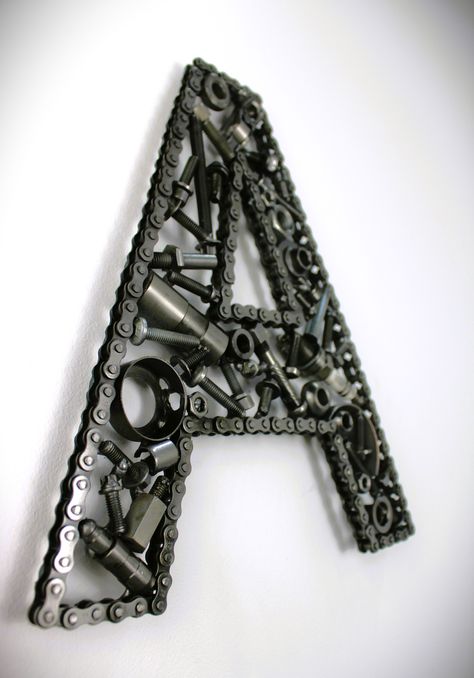 Car Part Letter A - Handmade Gift for Men, Repurposed Decor, Car Themed Sculpture Are you looking for a one-of-a-kind addition to your man cave or office? Look no further! Ben's Automotive Decor has got you covered with our custom-built car part letters. Each metal letter is crafted by hand using real automotive parts. Made entirely out of genuine car parts Measures approximately 10 1/2 inches long Includes free shipping in the USA Sturdy and made to last Custom sizing/fonts available Can be mad Mechanic House Decor, Engine Parts Decor, Vintage Car Room Decor, Brass Shell Casing Crafts, Automotive Decor Diy, Car Room Ideas, Car Parts Art, Racing Crafts, Vintage Car Room