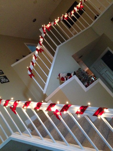 Candy cane banister Candy Cane Themed Christmas Decor, Candy Cane Fireplace Decor, Candy Cane Staircase, Candy Cane Bedroom Decor, Candy Cane House Decorations, Candy Cane Hallway Decorations, Christmas Railing Ideas, Candy Cane Theme Decorations, Banister Christmas Decor