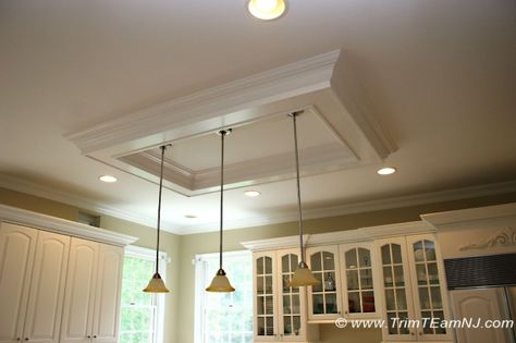 Coffered ceiling above kitchen island. To replace that old lighting in the kitchen. Ceiling Above Kitchen Island, Kitchen Lighting Remodel, Angled Kitchen, Country Kitchen Island, Waterfall Island Kitchen, Kitchen Ceiling Design, Log Home Kitchens, Lighting Makeover, Freestanding Kitchen Island