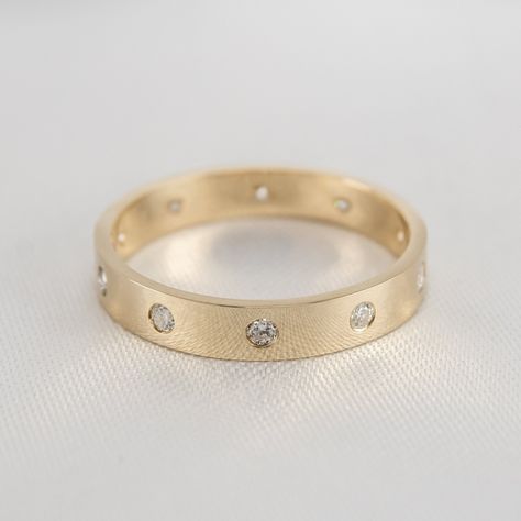 Perfect as a stackable ring or wedding ring, this stunning Spaced Diamond Band Ring is the perfect combination of elegance and modernity. With 1/4ct diamonds flush set to create an even surface, this one is easy to wear. Metal: 14k solid yellow Dimensions: approx 4mm ( 1/5") at widest Diamond: natural round diamonds, 1/4ct Inset Diamond Wedding Band, Flush Set Wedding Band, Spaced Diamond Band, Thick Gold Wedding Band, Thick Wedding Bands, Flat Wedding Band, Flush Set Diamond, Ring Stacks, Diamond Band Ring