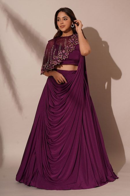 Buy Purple Lycra Embellished Sequins Solid Lehenga Saree Asymmetric Cape Set For Women by Chaashni by Maansi and Ketan Online at Aza Fashions. Shrug Lehenga Designs, Unique Lehenga Blouse Designs, Ethnic Lehenga Designs, Lehangas For Sisters Wedding, Night Wedding Function Dress, Saree With Shrug, Solid Lehenga, Dress With Shrug, Indo Western Outfits For Women