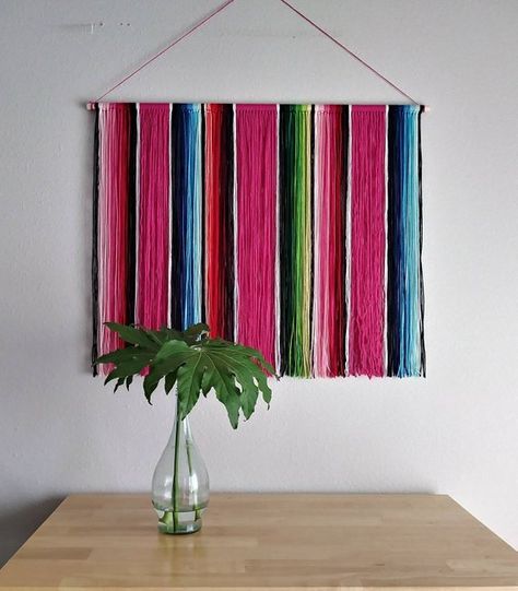 This Mexican Serape Yarn Wall Hanging is inspired by the classic Mexican serape blankets. Styled after the same fun, bright blends of color as in the serape blankets, this beautiful piece of fiber art would look great hung on any wall in your home that needs a bit of that Mexican Style Decor, Mexican Serape Blanket, Pink Bohemian, Serape Blanket, Mexican Serapes, Mexican Home Decor, Yarn Wall, Mexican Home, Yarn Wall Hanging