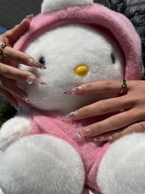 hello kitty vibes - sailor moon sparkly long almond nails - glitter and gold charms, transparent pink stiletto nails press on nail inspo summer nails 2023 outfit inspo kawaii core japanese style nails #sanrio #mymelody #kuromi #kawaiicore #sanriocore #summernails #pinkaesthetic #hellokitty #plushie #nailinspo Sanriocore Aesthetic, Sailor Moon Pink, Nails Sanrio, Press On Nail Kit, Pink Stiletto Nails, Sanrio Mymelody, Sailor Moon Inspired, Long Almond Nails, Aesthetic Baddie