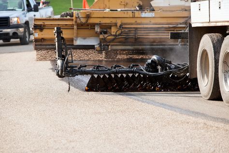 Tar and Chip Seal Vs. Gravel for Ranch Driveways. Check out this Elite Asphalt LLC blog post to compare tar and chip seal and gravel. Chip Seal Driveway, Tar And Chip Driveway, Gravel Drive, Asphalt Pavement, Asphalt Driveway, Gravel Driveway, Concrete Projects, Surface Water, Driveway