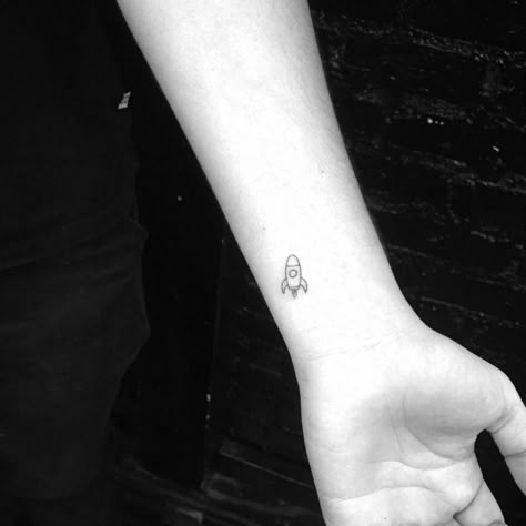 Tiny rocket tattoo on the left inner wrist. Rocket Ship Tattoo, Moms Tattoo, Spaceship Tattoo, Rocket Tattoo, Lavender Tattoo, Planet Tattoos, Small Tattoos With Meaning, Mini Tattoo, Small Tattoos Simple