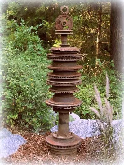 Gears and gadgets as garden art | Flea Market Gardening Rock Garden Decor, Hanging Rock, Flea Market Gardening, Garden Rock Art, Gear Art, Garden Junk, Welding Art Projects, Flower Sculptures, Metal Garden Art