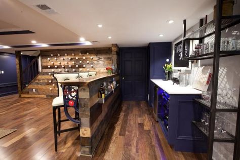 Even pint-sized basements can pull off a dramatic color in small doses. This open-floorplan basement demonstrates how thoughtful color placement can pack panache into the design without visually shrinking the space. A saturated-indigo color coats the built-in bar cabinets, the walls and doors as well as highlighting the vertical surfaces in the tray ceiling. The rest of the ceiling and the bar are a snowy-white hue that balance out the deep indigo tones and the room's rich wood finishes. Paint y Basement Paint Color Ideas, Best Color Combos, Basement Color Schemes, Built In Bar Cabinet, Basement Wall Colors, Basement Shelving, Basement Paint, Basement Craft Rooms, Basement Colors