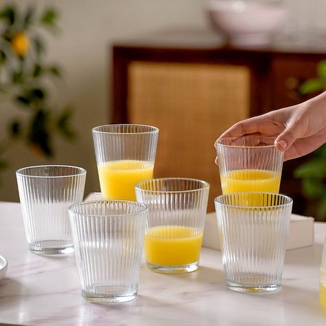 Raise your glass to summer vibes! 🥂 Sunny days call for refreshing drinks and our beautiful glassware is perfect for those summer cheers. 😍 Products featured: 1. Rotating Drinking Glass Set Of 6 150ml 2. Rotating Fluted Glass Set Of 6 150ml 3. Set Of 6 Fluted Tall Glass Tumbler 300ml 4. Set Of 6 Stackable Drinking Glasses Ribbed 5. Glass Ice Cream Dessert Bowl Set Of 6 120ml 6. Set Of 6 Highball Glass Tumbler 230ml 7. Set Of 6 Fluted Glass Tumbler 260ml 8. Pebble Textured Tall Drinkware Set... Cocktails And Mocktails, Crystal Texture, Home And Decor, Drinking Glass Sets, Fruit Infused Water, Drinkware Sets, Fluted Glass, Glass Tea Light Holders, Vintage Jars