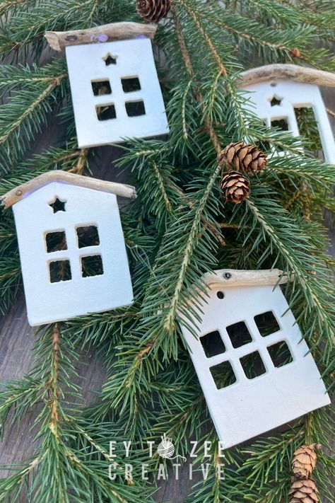 These cute tiny house air-dry clay ornaments make up a Christmas village on your tree. And for a few bucks in materials, you can make beautiful decorations. Clay House Ornaments Diy, Diy Air Dry Clay Christmas Village, Air Dry Clay Houses How To Make, Modelling Clay Christmas Decorations, Air Dry Christmas Decorations, Air Dry Clay Xmas Decorations, January Diy Crafts, Air Dry Clay Houses Diy, Air Dry Clay Houses