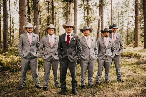 Gray, blush, and burgundy groomsmen with cowboy hats Cowboy Wedding Tuxedo, Burgundy And Blush Mens Wedding Attire, Western Groomsmen Attire Grey, Cowboy Hat And Suit Wedding, Wedding Suit With Cowboy Hat, Suits And Cowboy Hats Wedding, Grey Suit With Cowboy Boots, Western Groomsmen Attire Burgundy, Groomsmen With Cowboy Hats